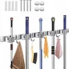 Wall-mounted holder with 5 clamp brackets, 56 cm long rail, broom holder, for tools and other items with handles.